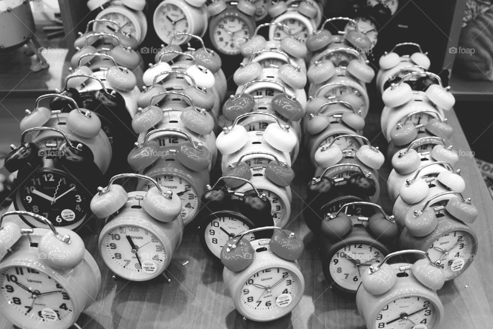 Black and white analogue twin bell clocks