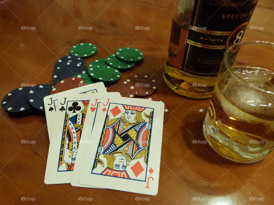 poker  hand chips  and  whisky 