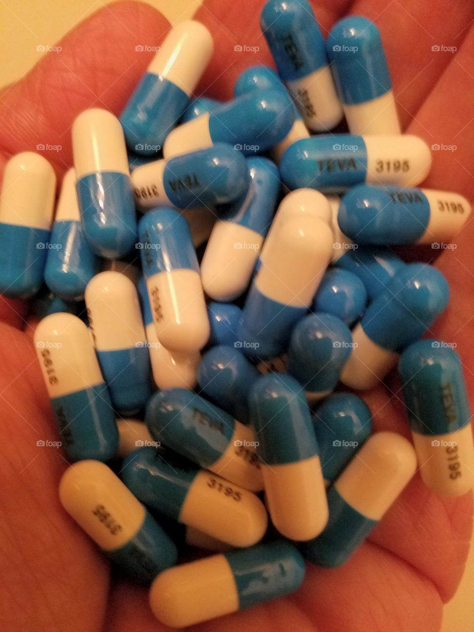 Medication Capsules, blue and white.
