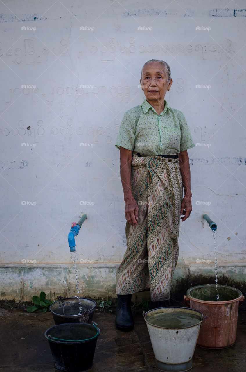 Fetching water in inle, Myanmar 
