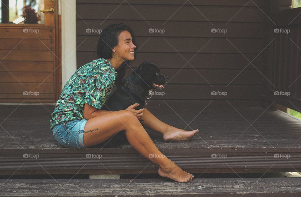 walking the dog down the street, the owner walks the weakling, teaches her, cleans up after her, educates, plays with his pet. people and dogs are best friends