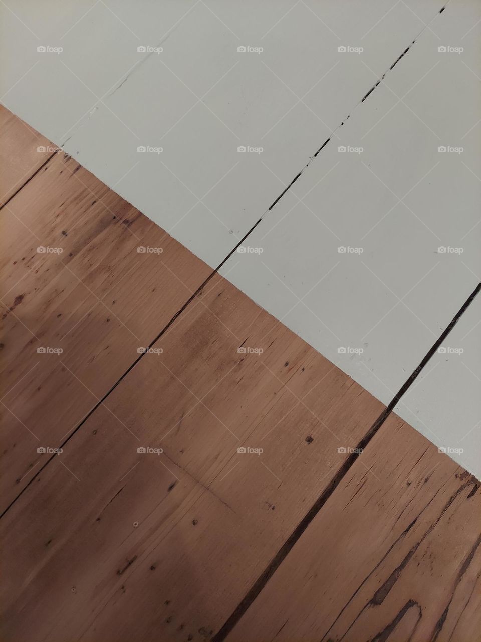 The line between original, refinished hardwood and painted.