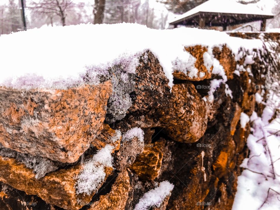Snow on a stone wall in New England