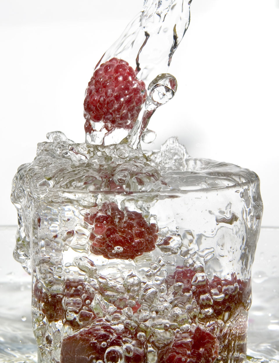 Raspberry in glass of water