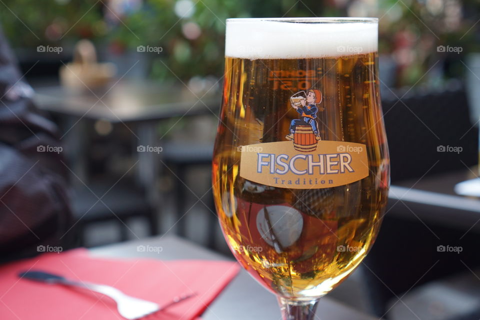 Fischer beer. An expertly poured Fischer beer at an outdoor cafe in Strasbourg, France.