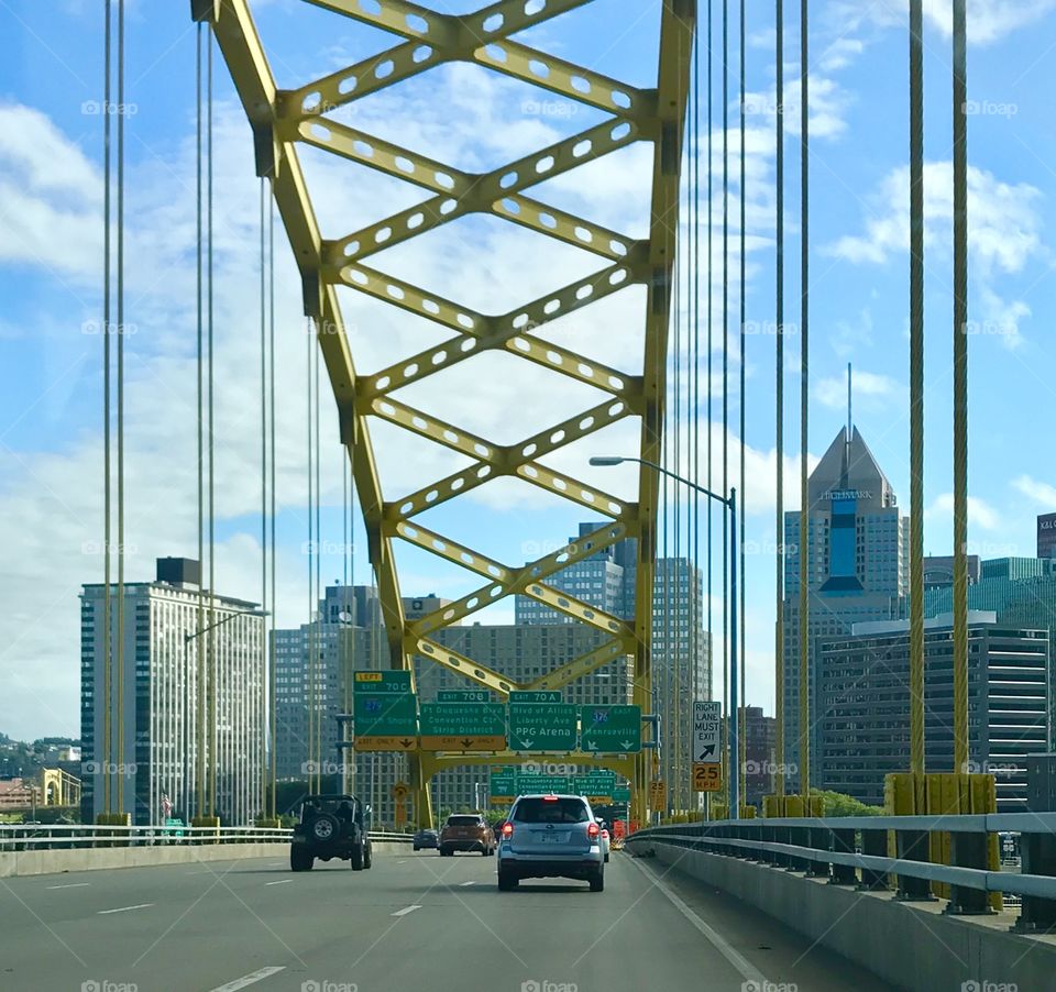 Fort Pitt Bridge, Pittsburgh PA city in the background with cars crossing the bridge