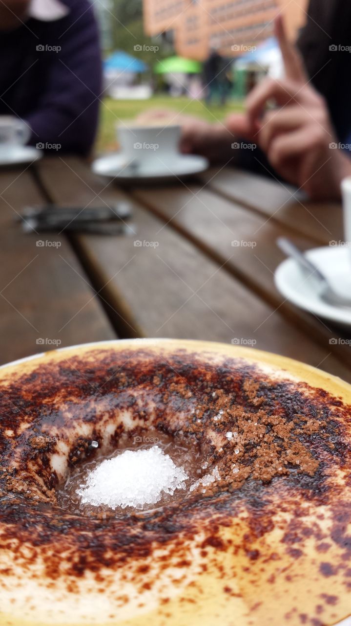 Outdoor meeting over coffee . Outdoor meeting over coffee - a more productive way to discuss different issues regarding work. 