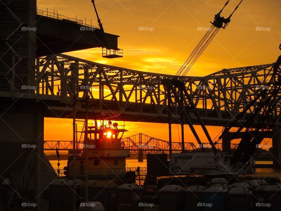 Sun setting thru the bridge
