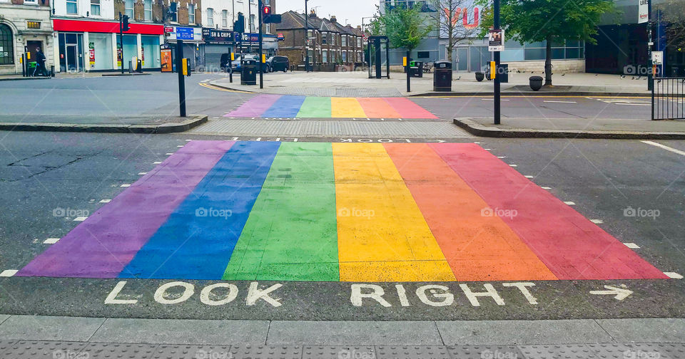 Rainbow colored pedestrian road crossing.