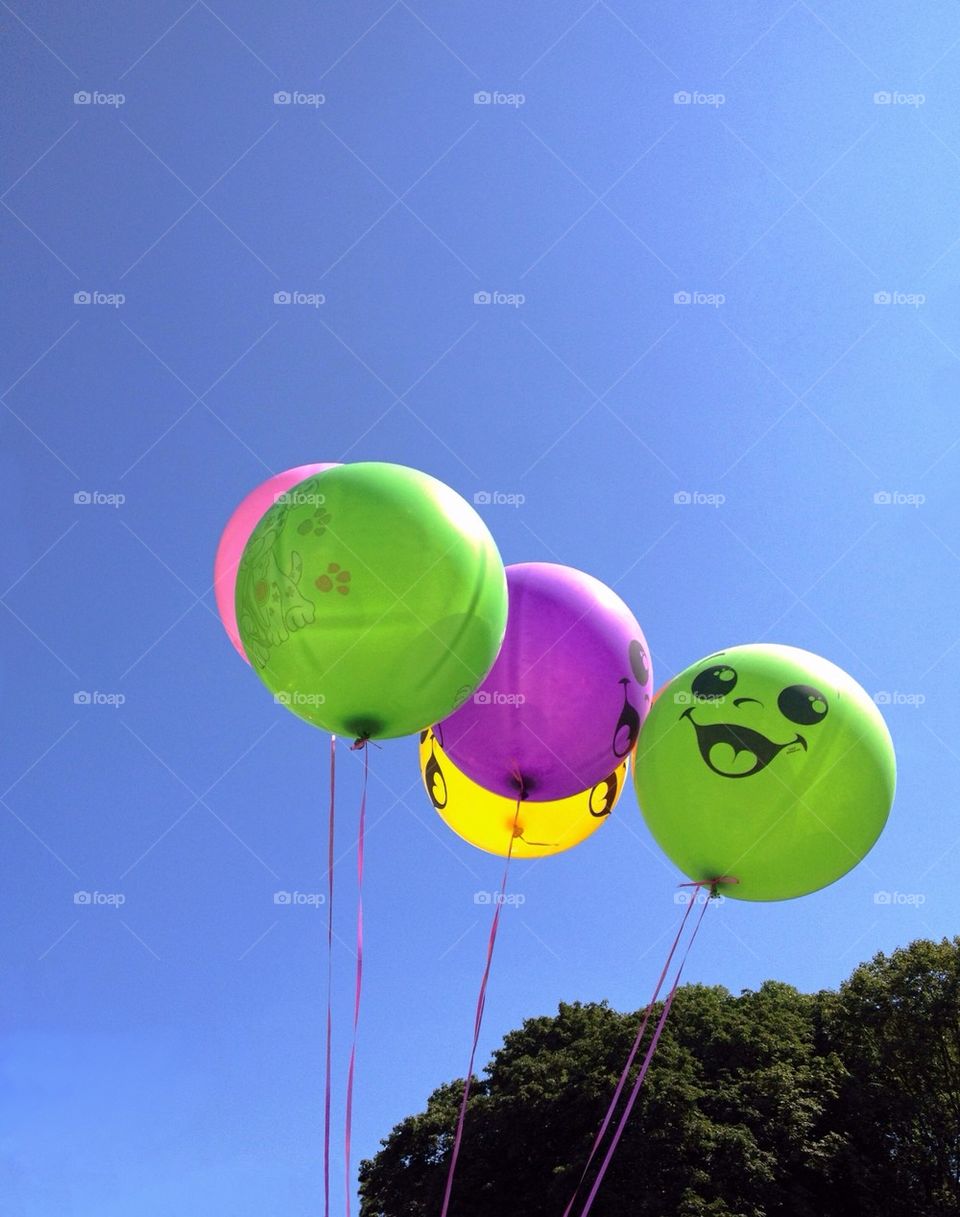 Colorful balloons agains blue sky