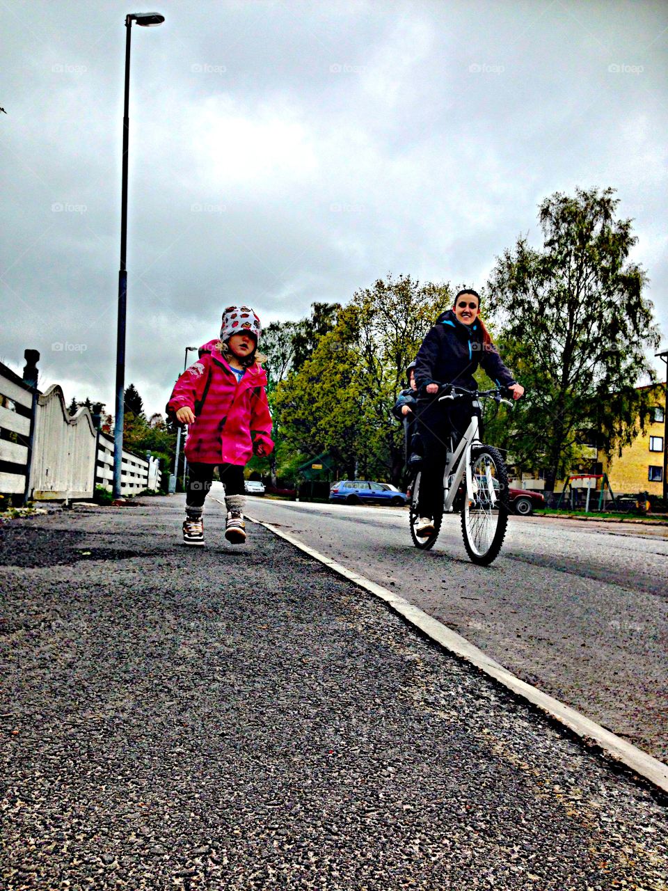 Woman cycling on road