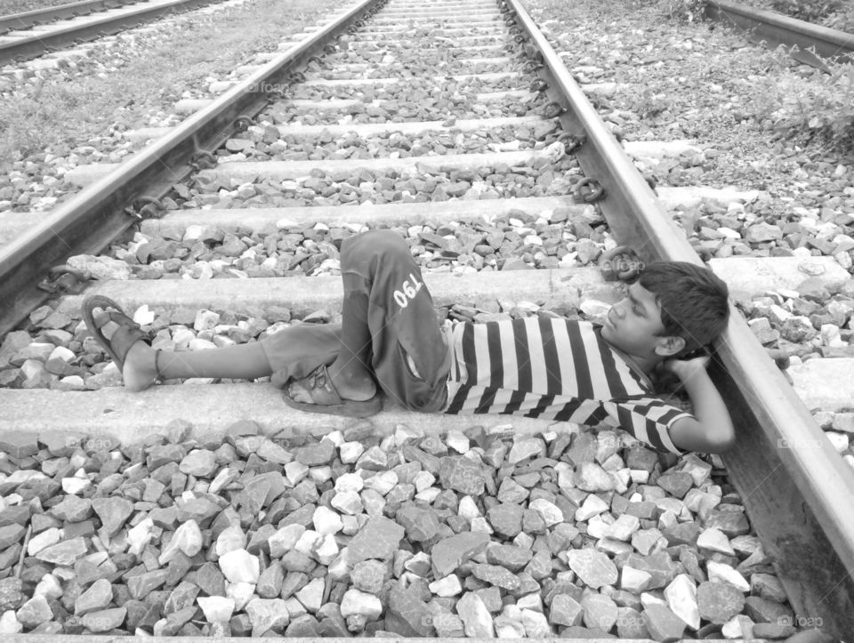boy photo/one boy on railway line photo/railway line photo/one poor boy on railway line photo/boy and railway line photo/a pics of poor kid/a good boy phot/sweet boy photo/poor boy single photo/good photo for you