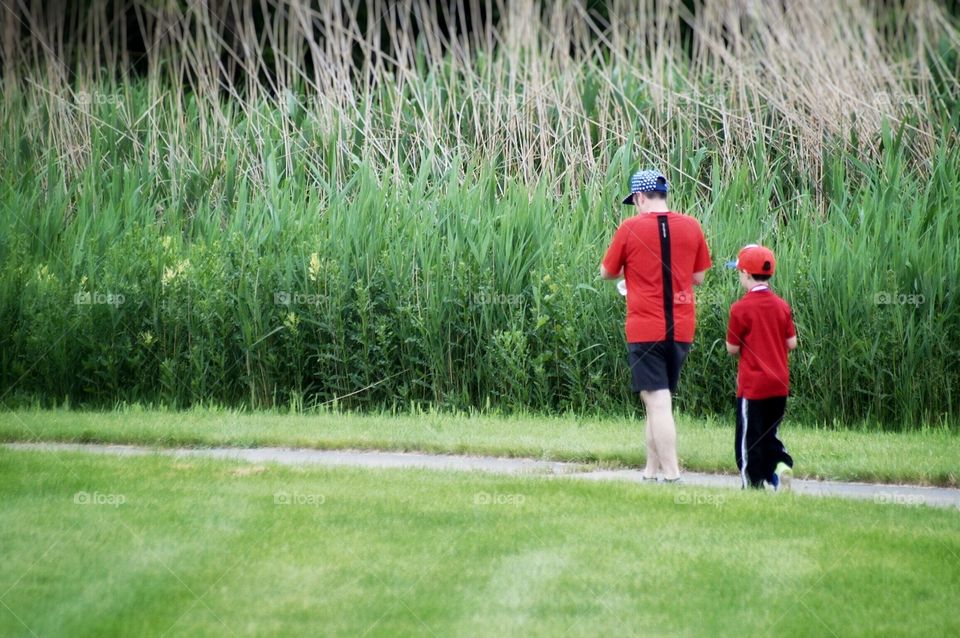 Father and son taking a walk