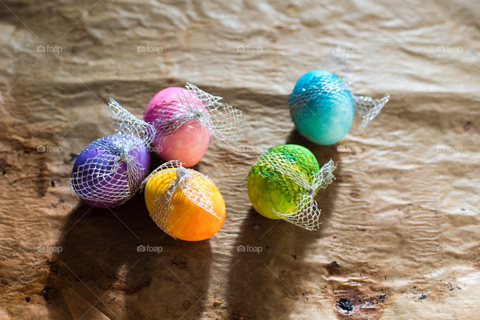 colorful Easter eggs on rustic background