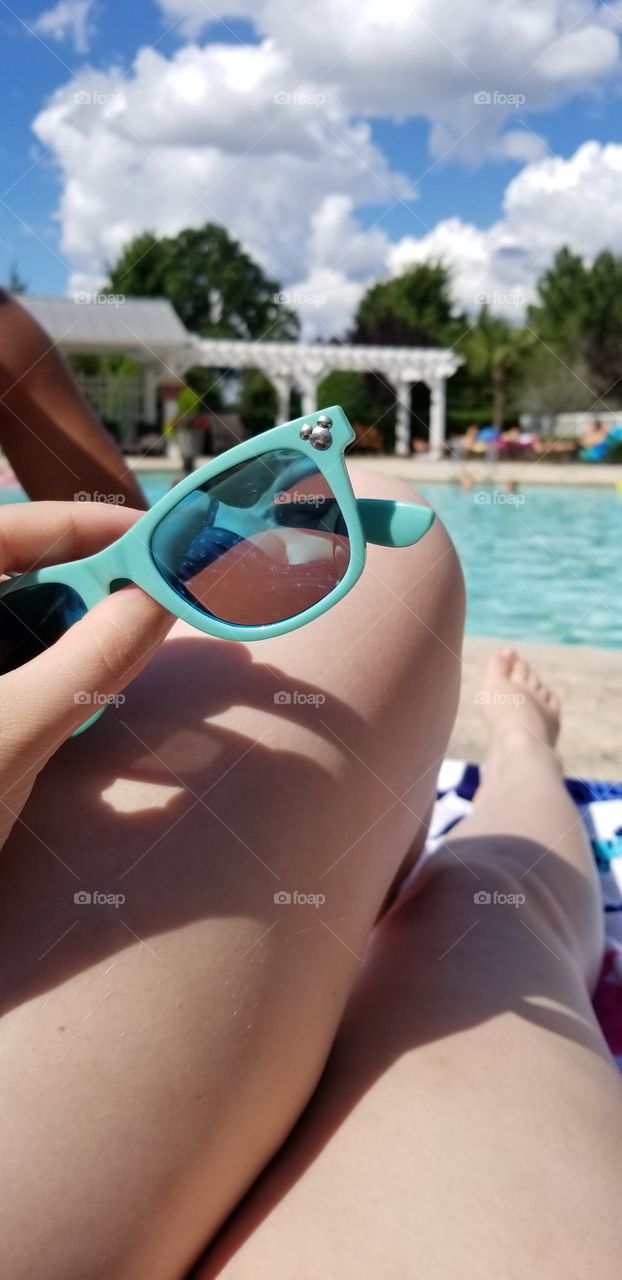 sky blue Disney sunglasses at a pool