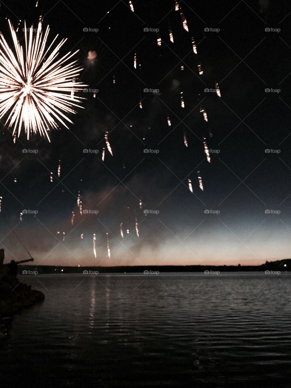 Fireworks over the local harbour. Nova Scotia, Canada.