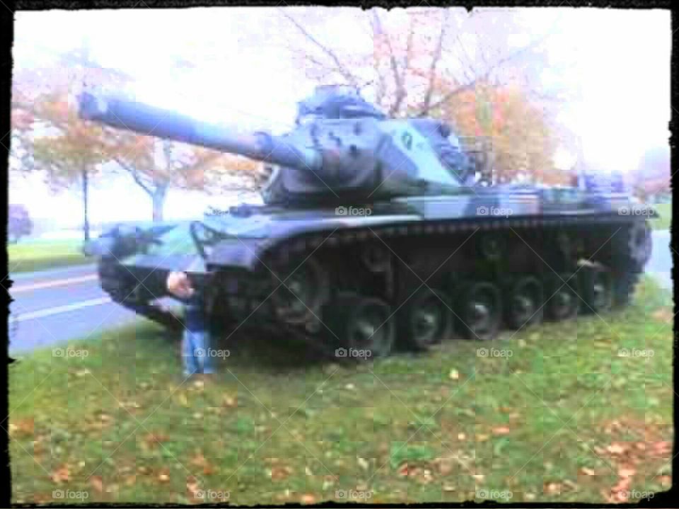 Army tank. Tristan standing beside an Army tank on the side of the road in NJ