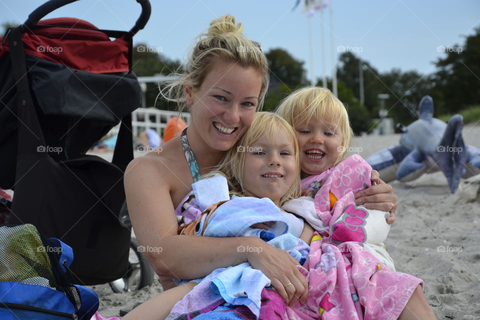 Mother with her doughters at the beach Ribban in Malmö Sweden.