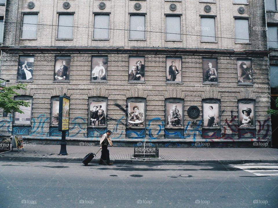 Man with a suitcase on an empty street