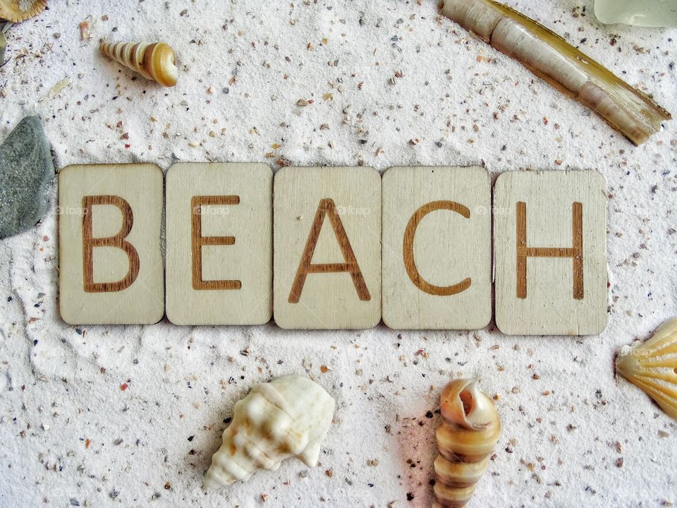 Word beach with wooden letters