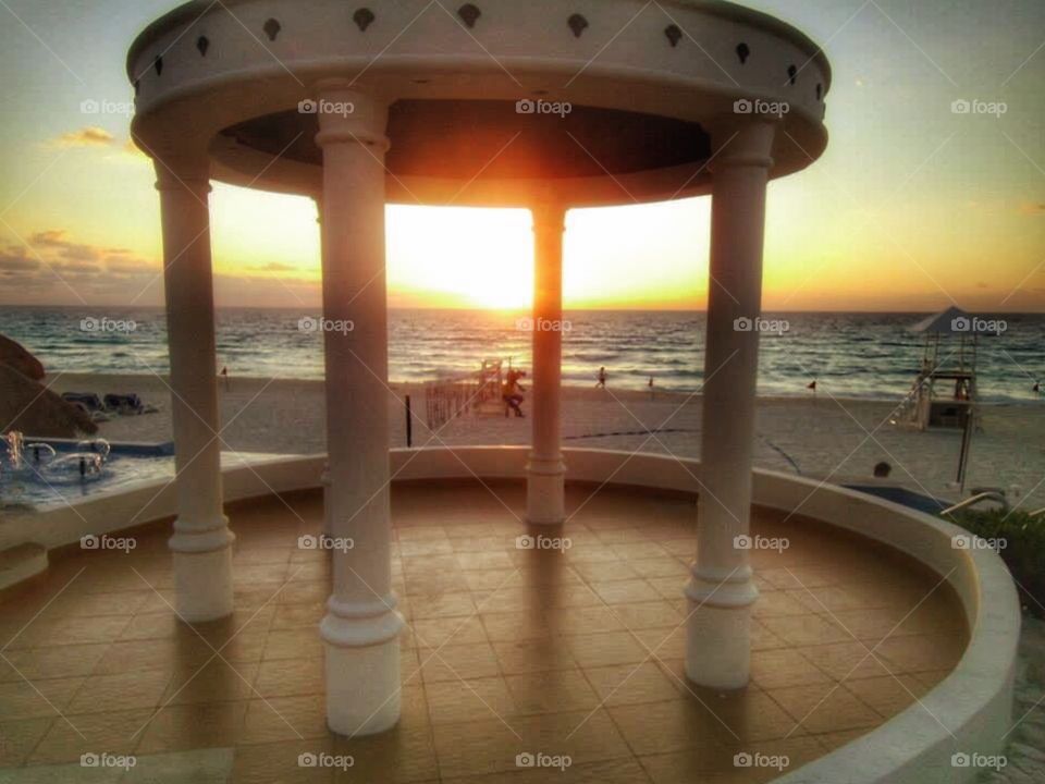 Sunrise viewed through a temple in Cancun