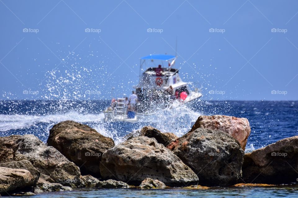 Splashing sea water against the rocks