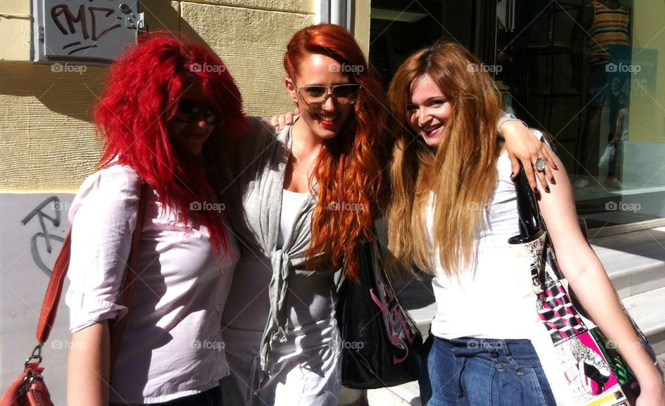 Women red hair blonde friends smiling happy sunglasses
