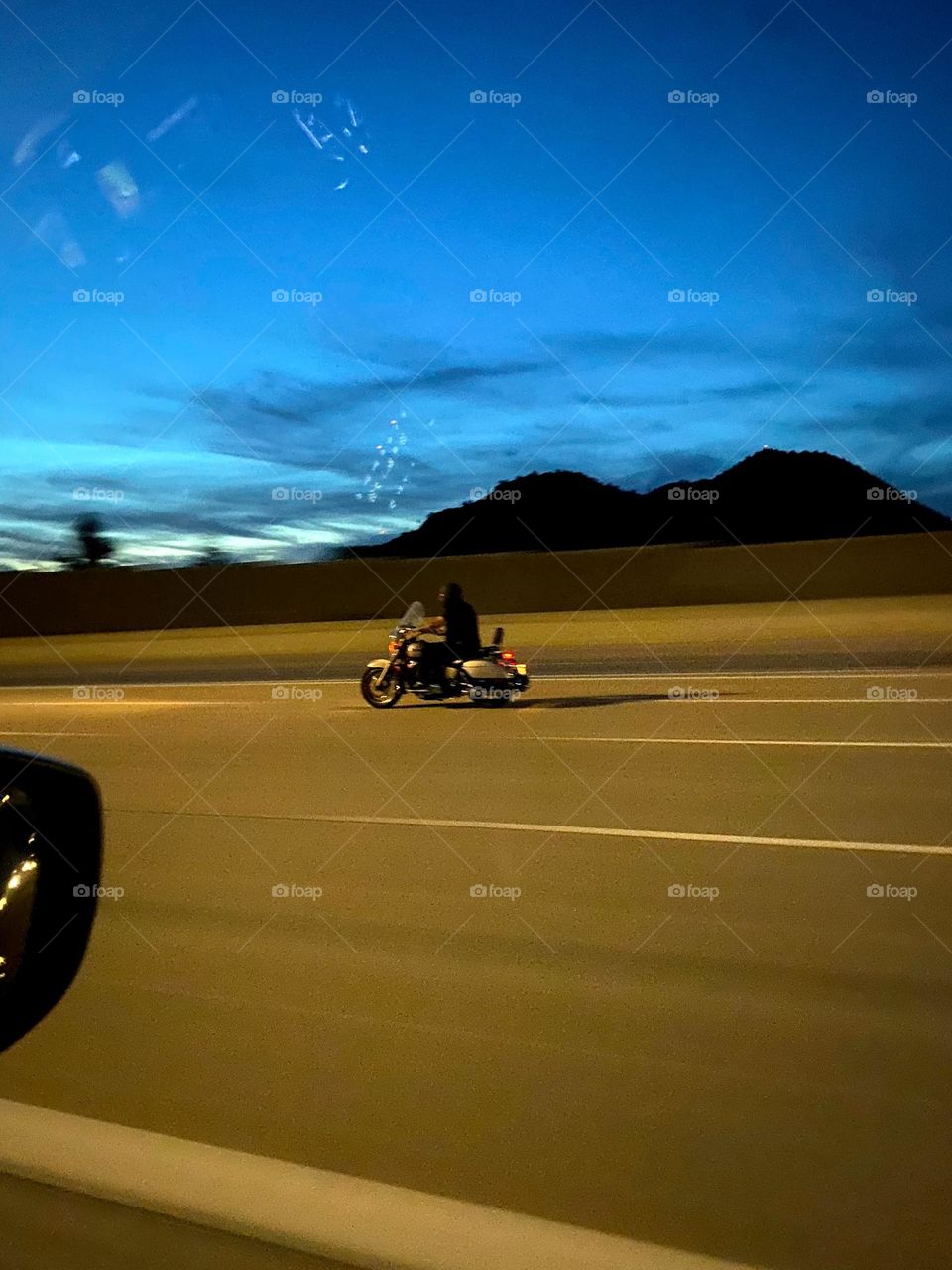 Riding motorcycle on freeway at night