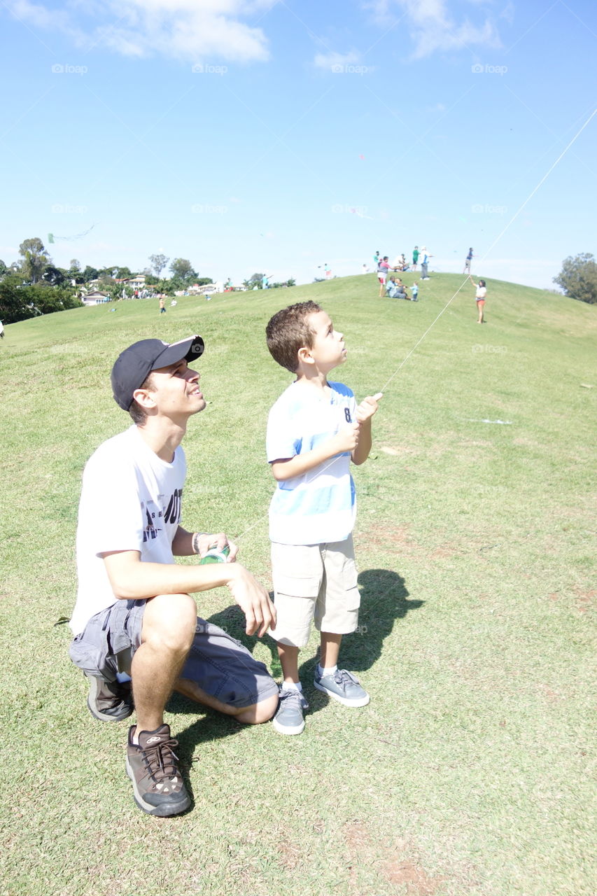 Father and son flying kite