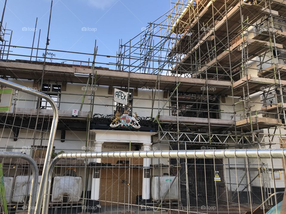 Almost total rebuild of the Royal Clarence Hotel, which burnt down, making great progress in terms of its rebuild. 