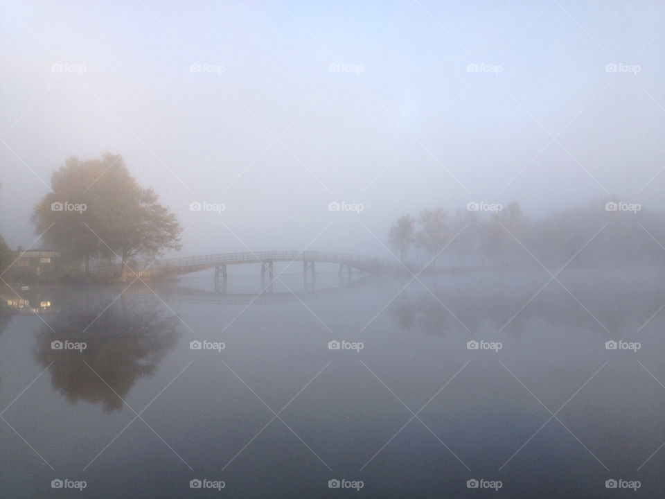 river lake fog walking bridge over dizzy water mystic morning calm misty göta älv trollhättan sweden trollhättan sweden by zebra
