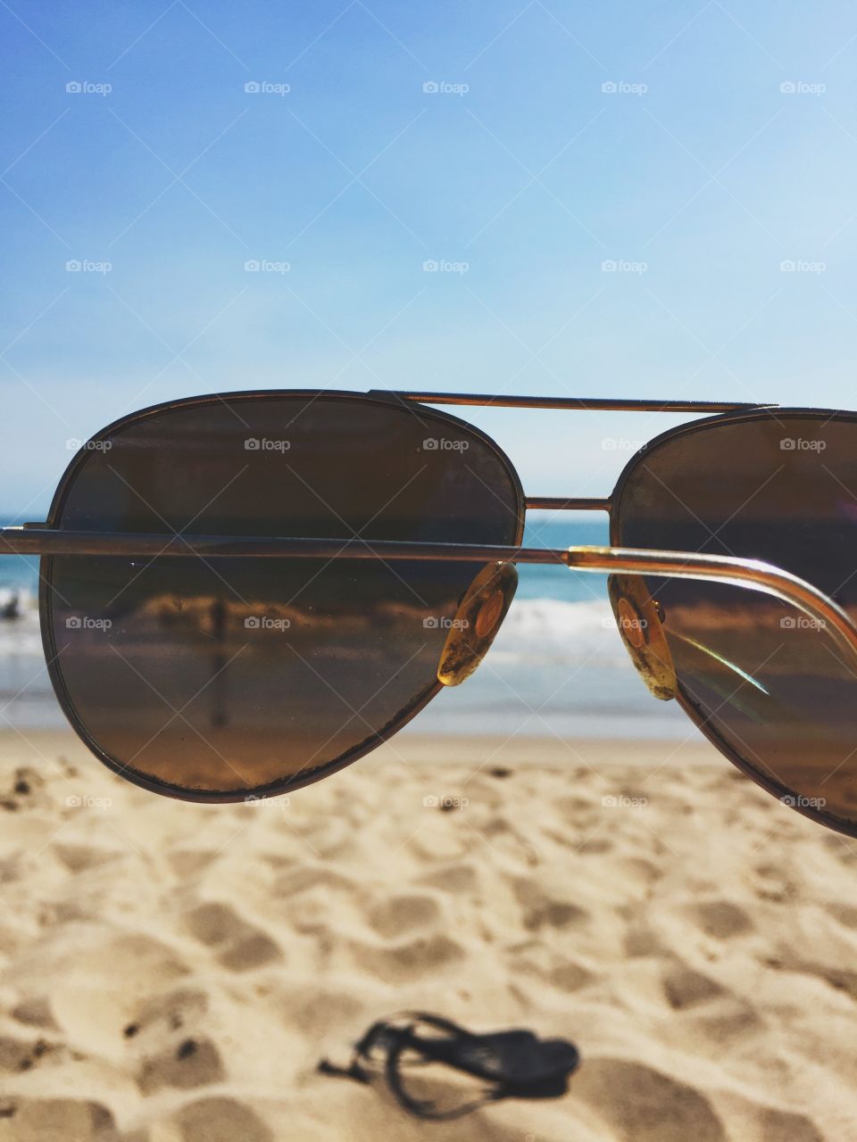 The beach seen through a pair of sunglasses 