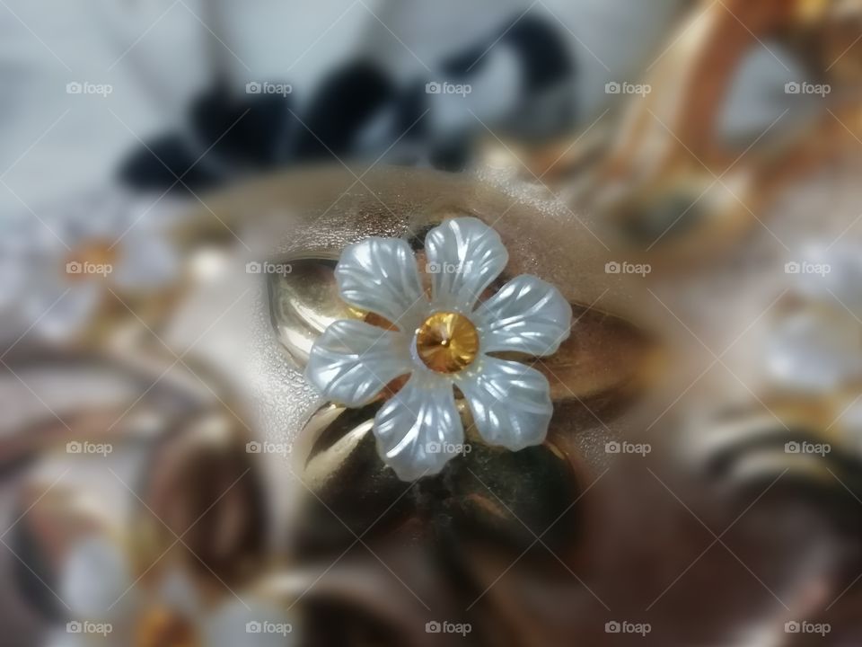 White colored gem stone flower on a flower vase