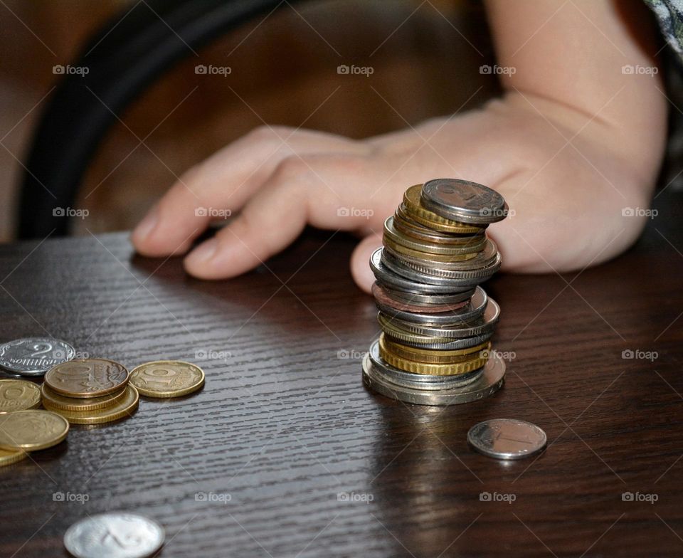 coins round beautiful texture and child  hand