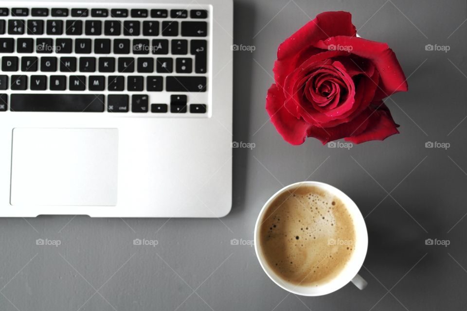 Office desk with computer and coffee cup