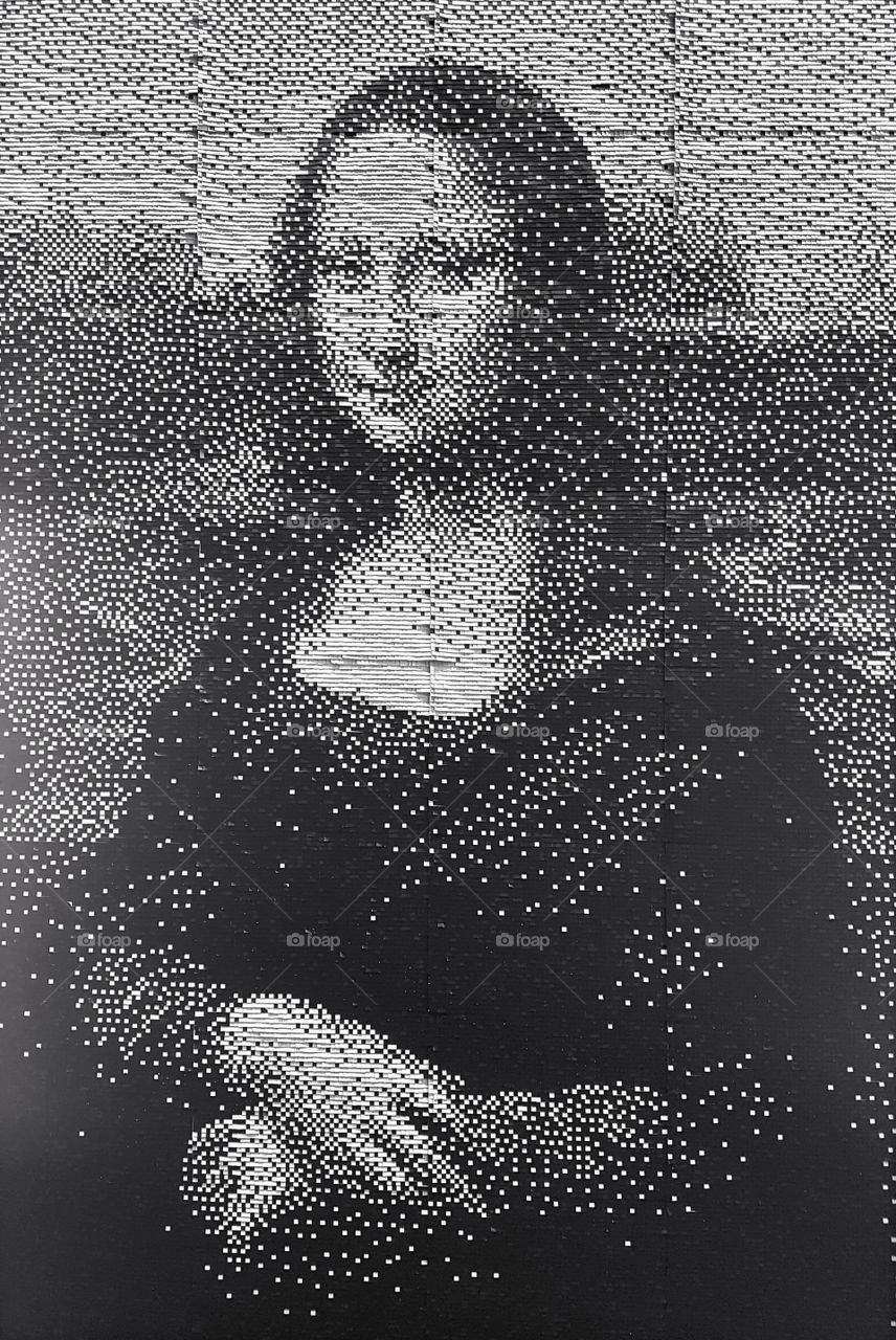 Artwork portrait of Mona Lisa made out of old train subway tickets