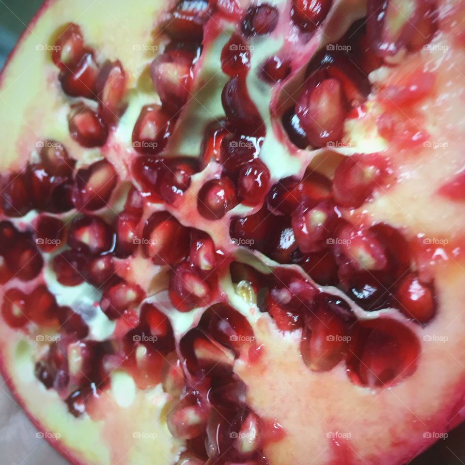 Pomegranate fruit cut in half. 