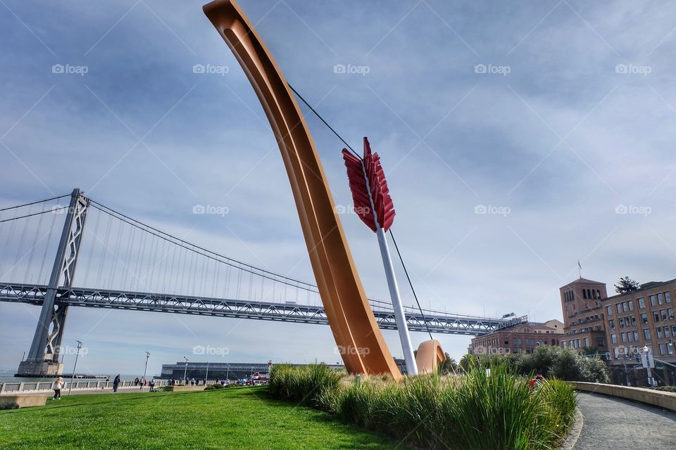 The Cupid Span in San Francisco with a view of the Bay Bridge in the background. 