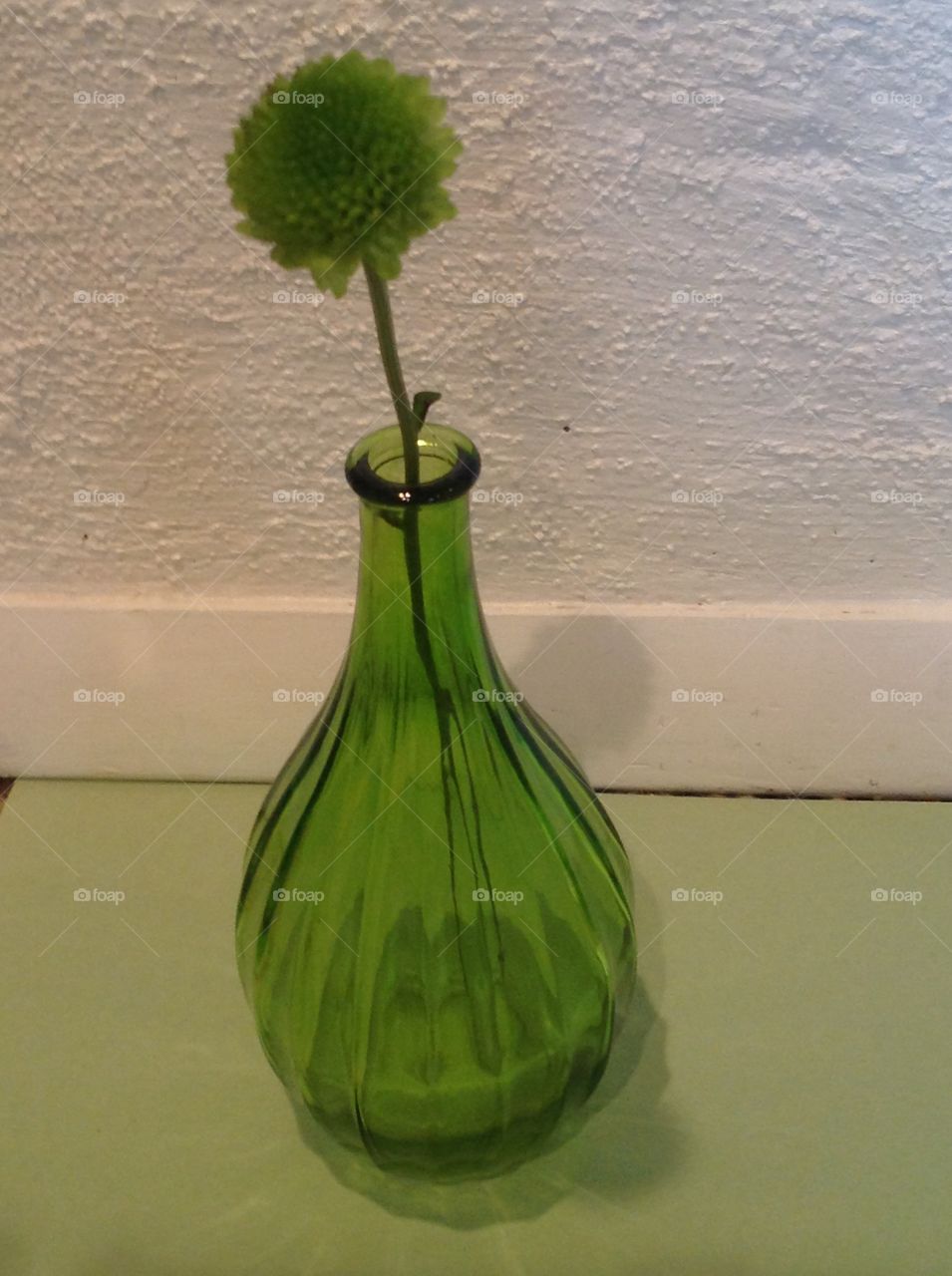 A green glass vase.