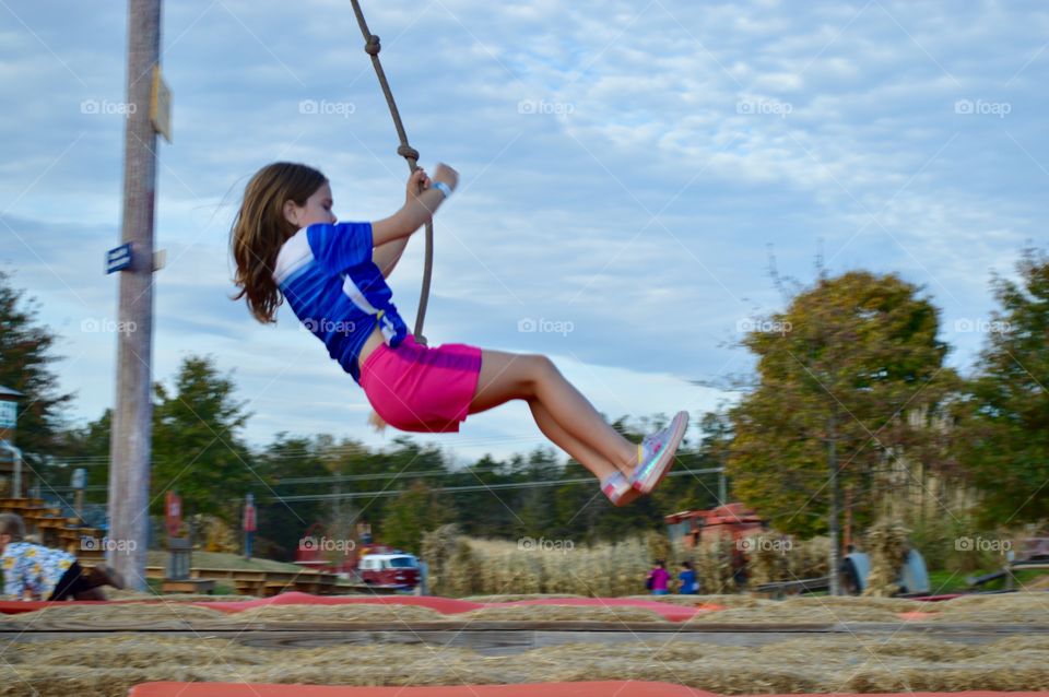 Girl on a rope swing