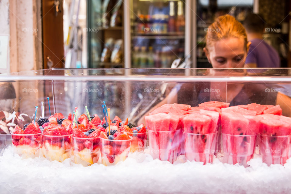 Saleswoman In A Fruits Shop