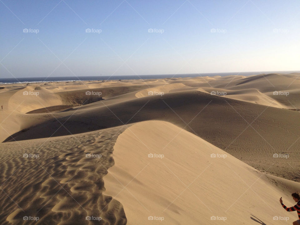 View of sand dunes near sea