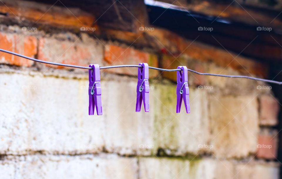 Purple clothes pins on the string