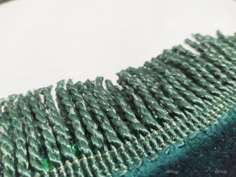 The end of the prayer mat with tassel