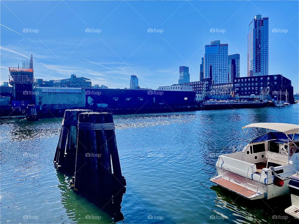 Looking at “Greenpoint”, Bklyn from LIC, Queens at “Newtown Creek” beneath the “Pulaski Bridge” and at the pilings in the water that mark the that parked distance boats must clear from the bridge. 2023. Hypnotic Productions