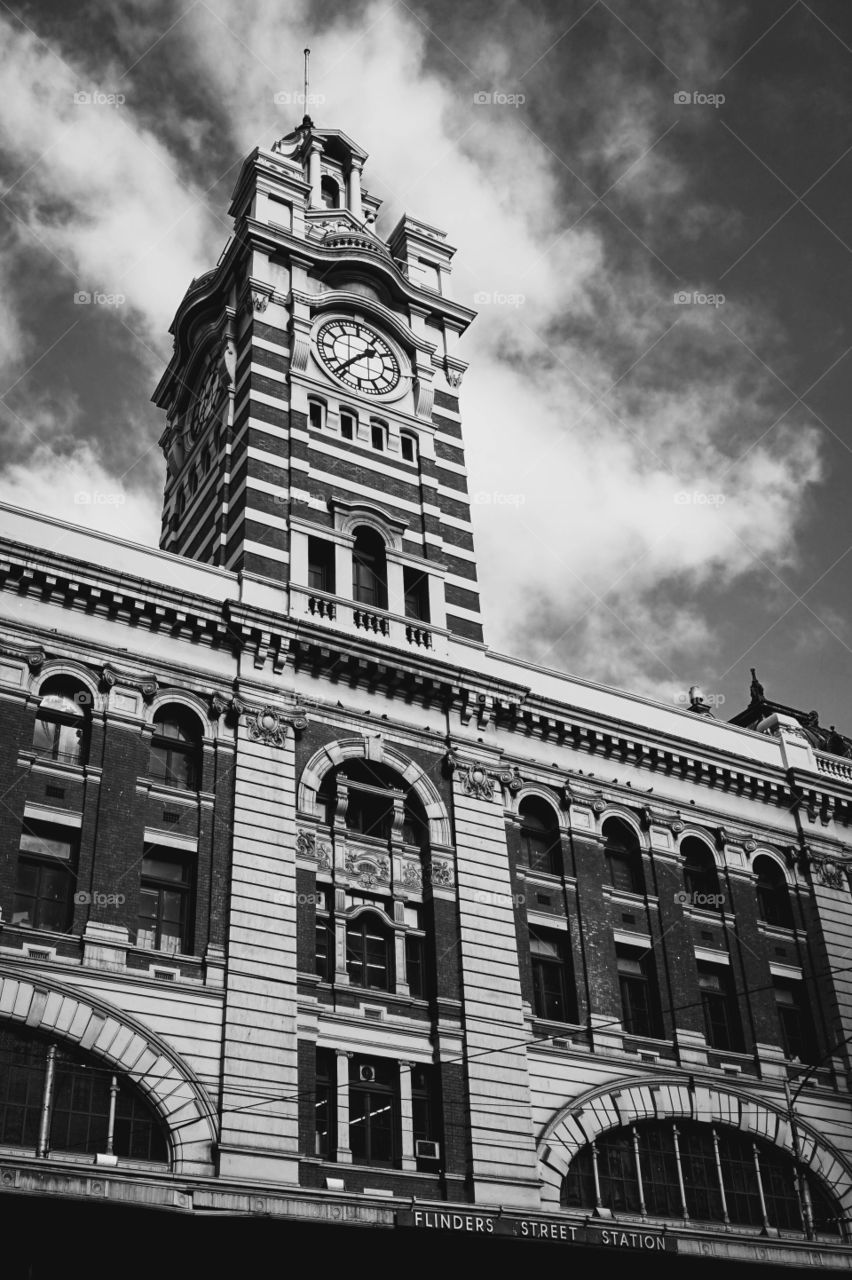 Beautiful contrasts of the clock tower at Flinders Street Station, Melbourne, Australia 