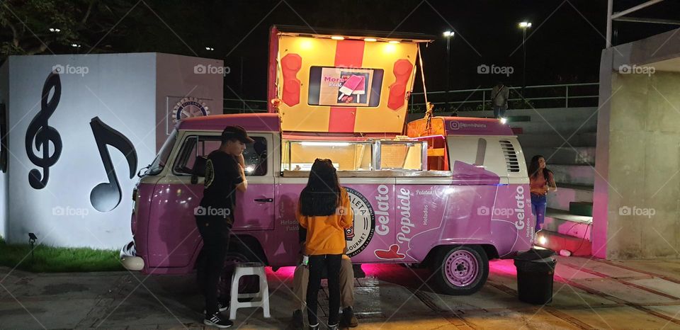 Old volkswagen truck, updated and used for selling ice cream of various flavors, itinerant fur shop. Pink color