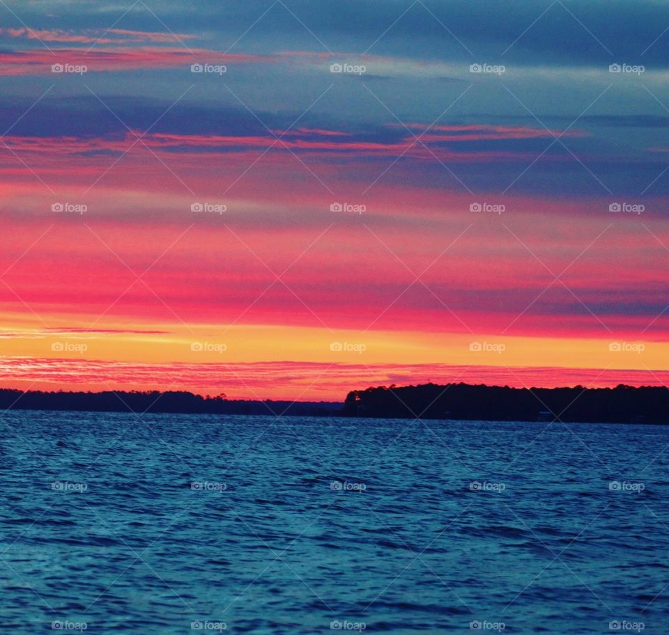 Scenic view of sea at sunset