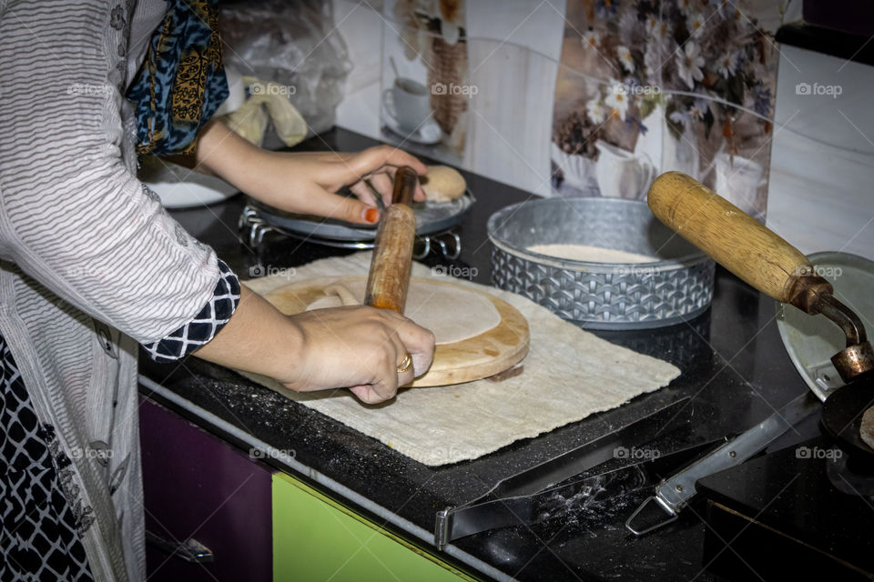 Belan patra made of wood is used in roti making process