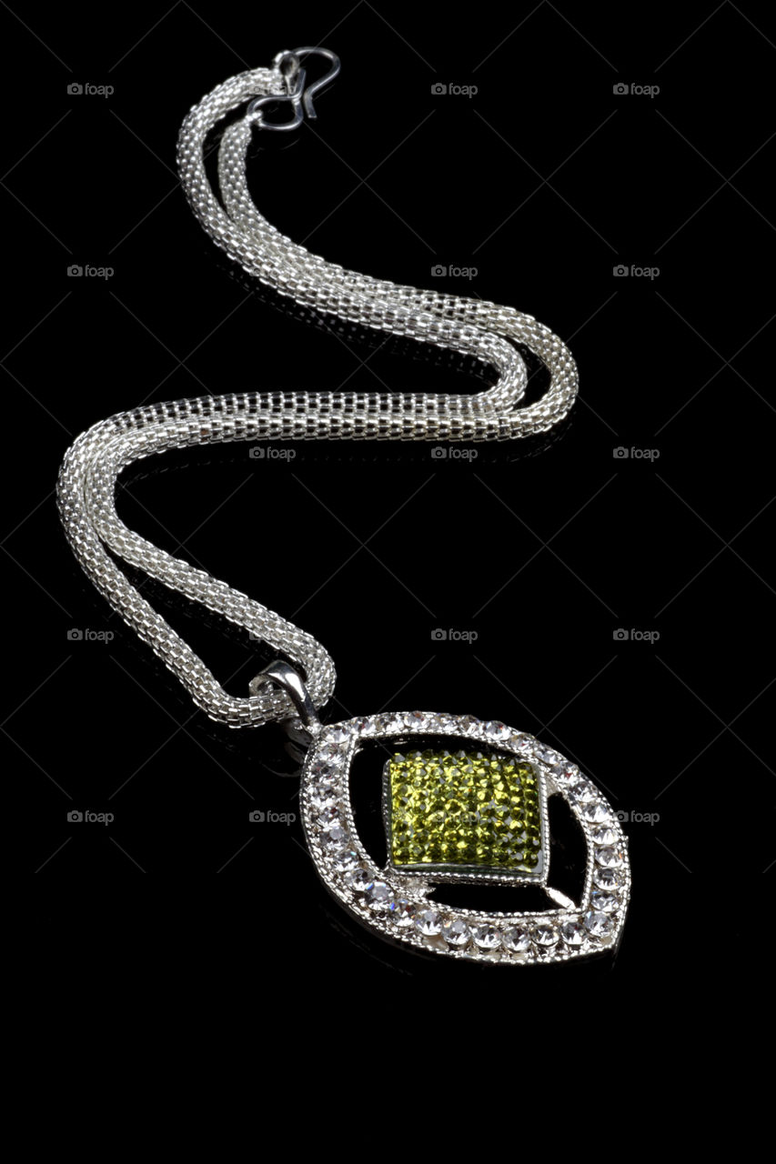 Green colored pendant with silver chain jewelry